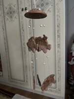A unique, fairy-like ceramic wind chime.