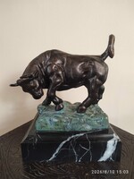 Imposing bull sculpture on marble base