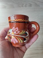 Glazed ceramic small jug with folk flower motif