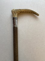 Riding stick with deer antler and silver handle.