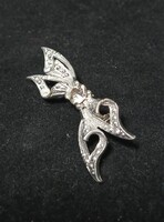 Vintage silver-colored bow brooch