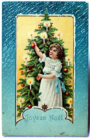Vintage embossed Christmas greeting card - girl decorating a Christmas tree 1907