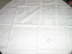 Beautiful white and blue cross-stitched elegant damask tablecloth