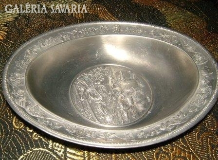 A marked pewter serving bowl with a relief pattern is rare!