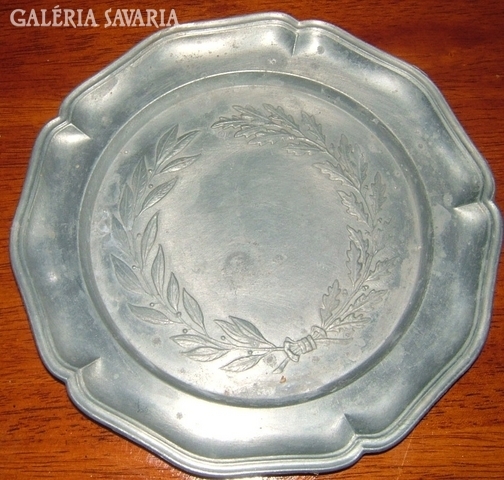 Marked, old, pewter wall plate with laurel wreath