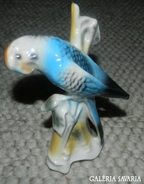 Parrot on a tree branch - porcelain figure