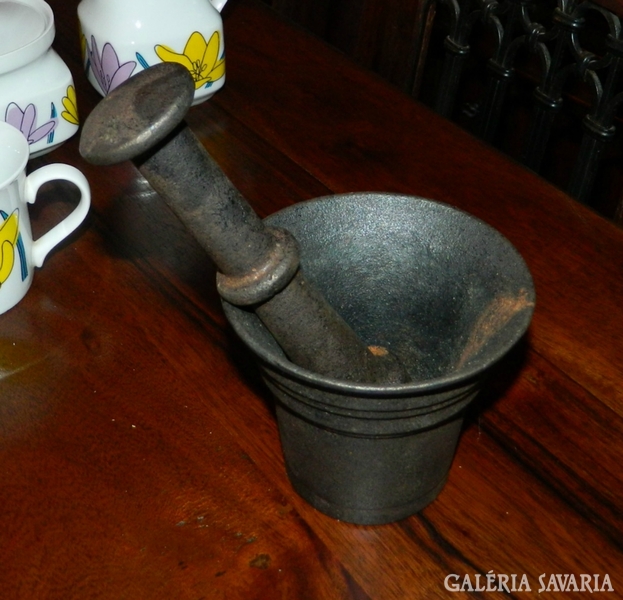 Antique iron mortar with pestle