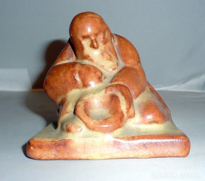 Ceramic beggar figure