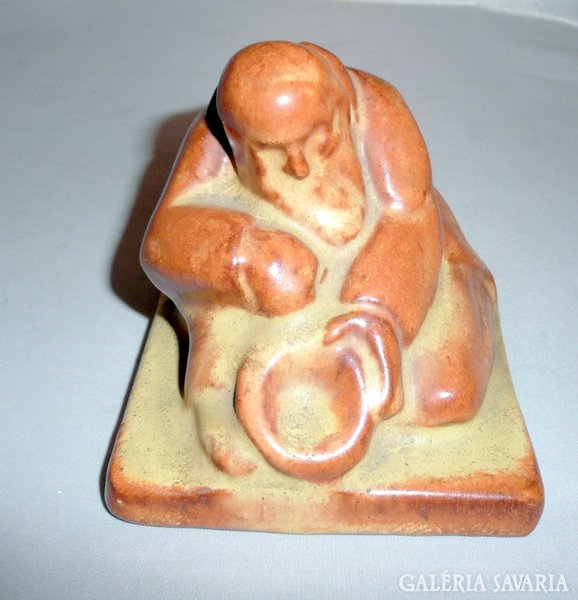 Ceramic beggar figure