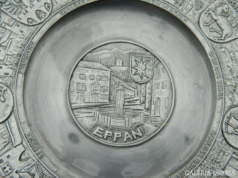 Marked pewter wall plate with relief pattern