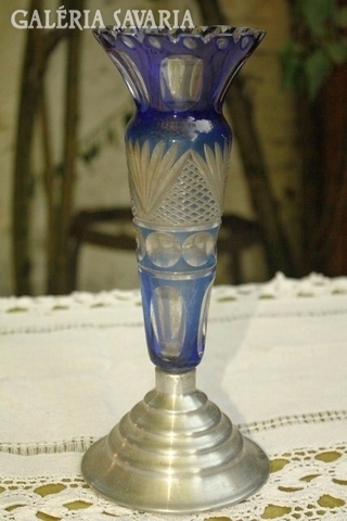 Polished glass or crystal vase with metal base