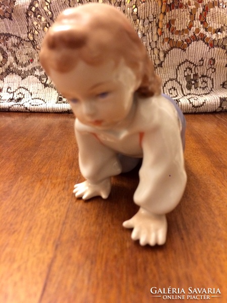 Zsolnay climbing child figurine