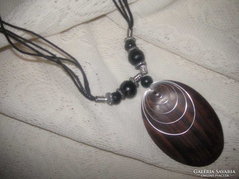 Necklace metal, wood, leather, the pendant is made of beautiful veined ebony wood