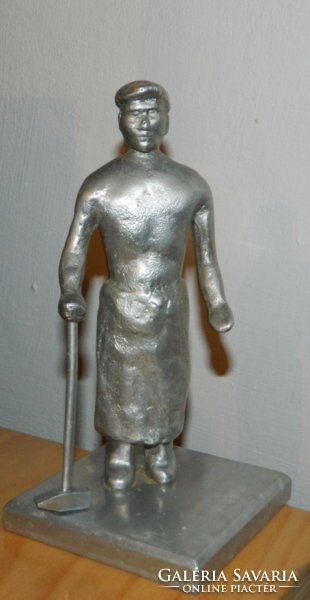 Metal worker statue