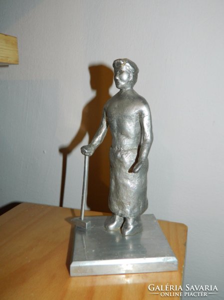 Metal worker statue