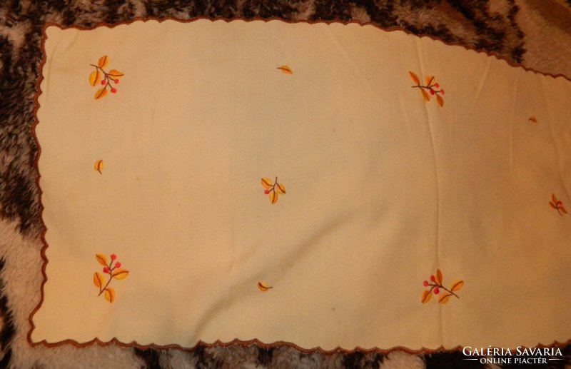 Small flower pattern embroidered tablecloth on a yellow background