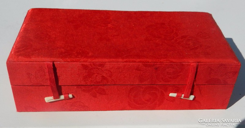 Box with divided compartments covered in silky fabric