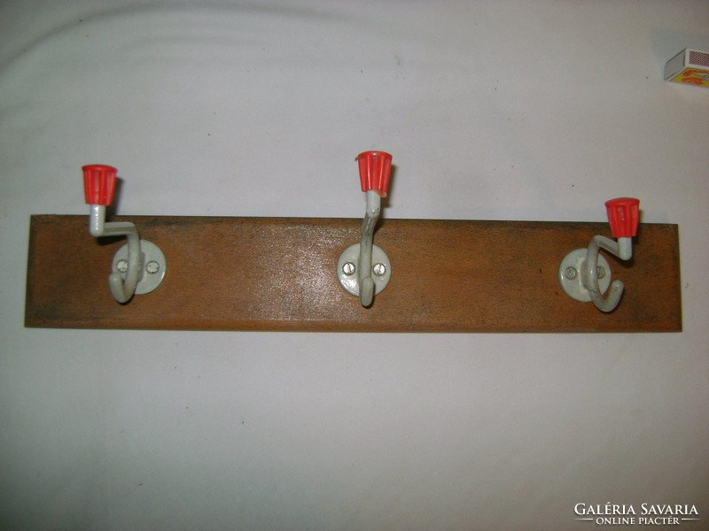 Old wall hanger with metal hangers