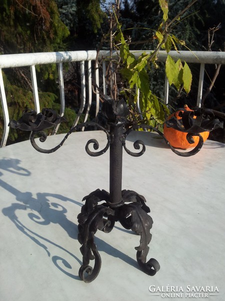 Antique wrought iron candlestick with two arms
