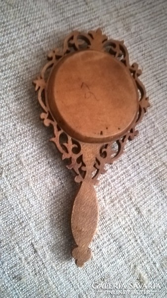 A small handmade wooden framed mirror