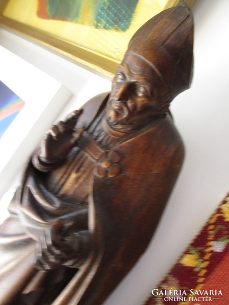 Antique carved bishops giving a big blessing, priest, church work