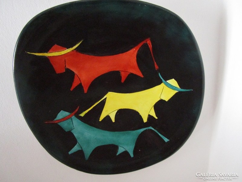 Art deco deco can be used as a wall decoration decorative plate on a black background colored bull industrial art artistic