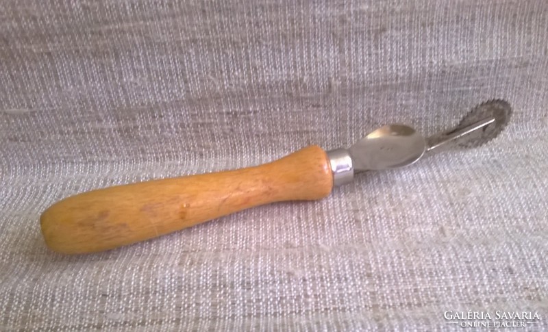 Old leather rádli with wooden handle