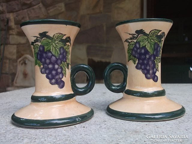 A pair of candle holders with handles for the garden table and wine cellar