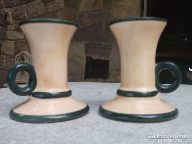 A pair of candle holders with handles for the garden table and wine cellar