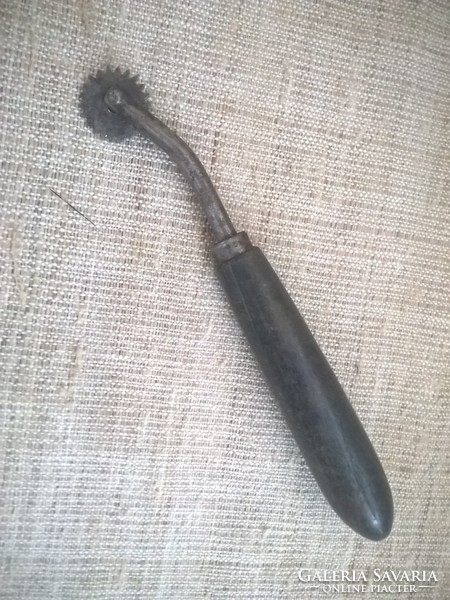 Old leather rádli with wooden handle