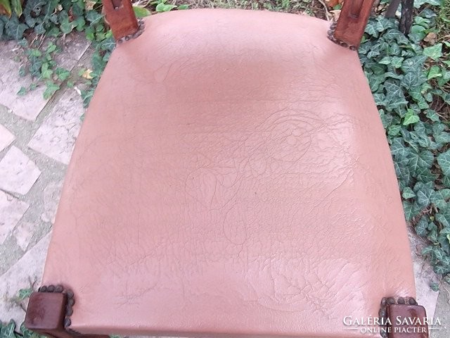 Art deco leather-upholstered chair, solid and stable