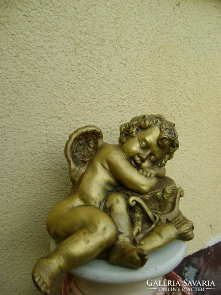 A brutal fire-gilded statue made of heavy iron alloy in the xx. A real antique piece from the beginning of the century
