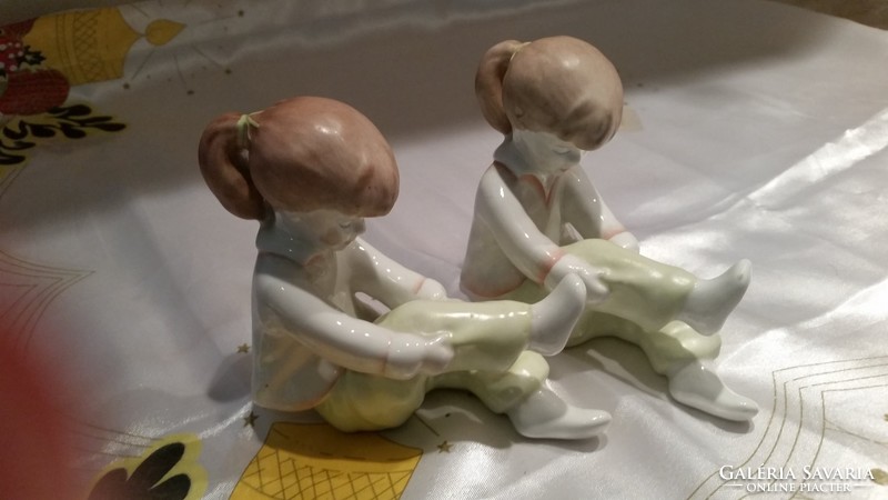 Little girl lacing shoes 2 pieces for sale! Pair of porcelain statues for sale!