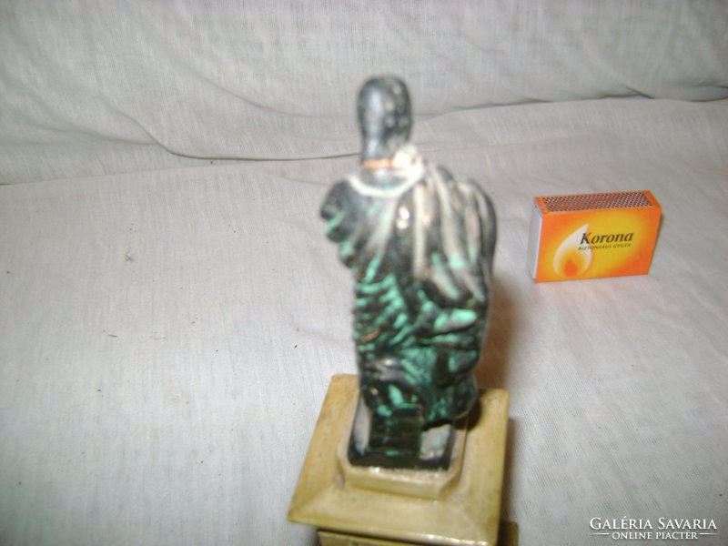 Old ceramic statue, display case