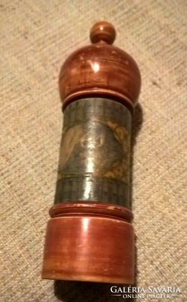 Old perfume bottle in a wooden holder