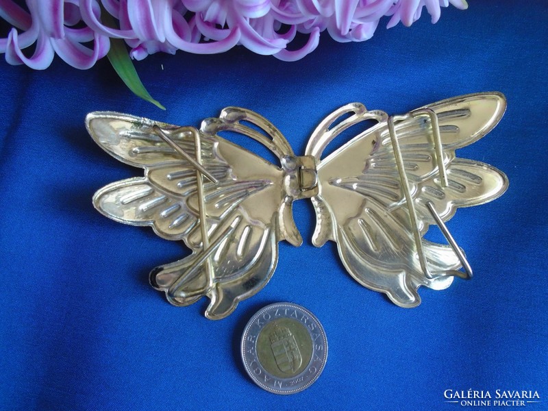 Butterfly dress ornament.