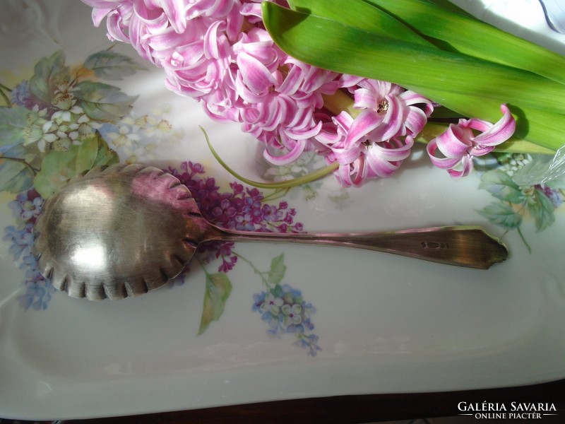 Beautiful large English antique garnished spoon.