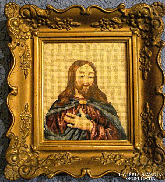 Needle tapestry depicting an old Christ in a gilded blondel frame