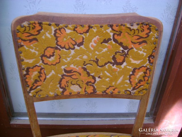 Old upholstered chair with backrest