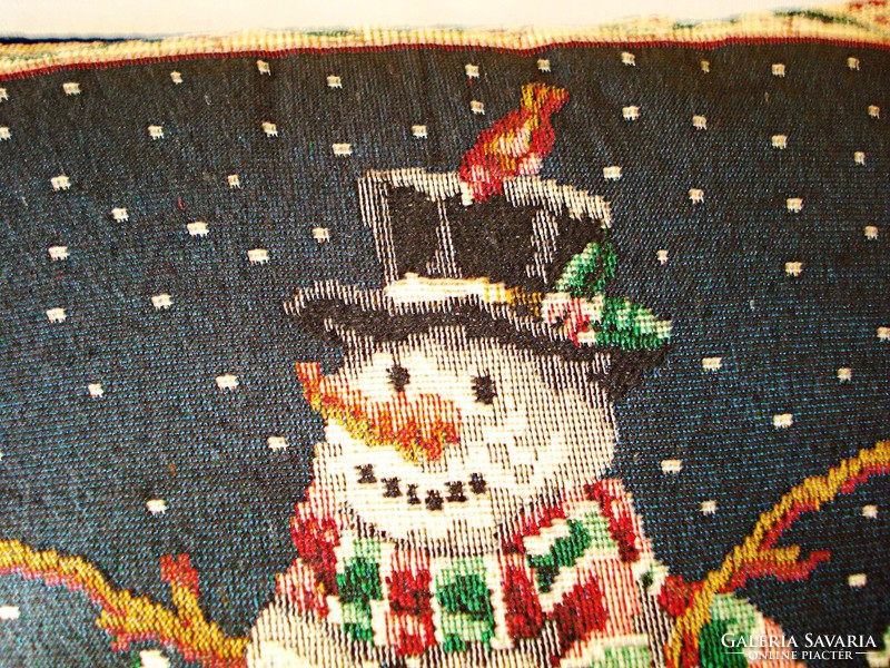 Tapestry cushion decorated with snowmen and bunnies