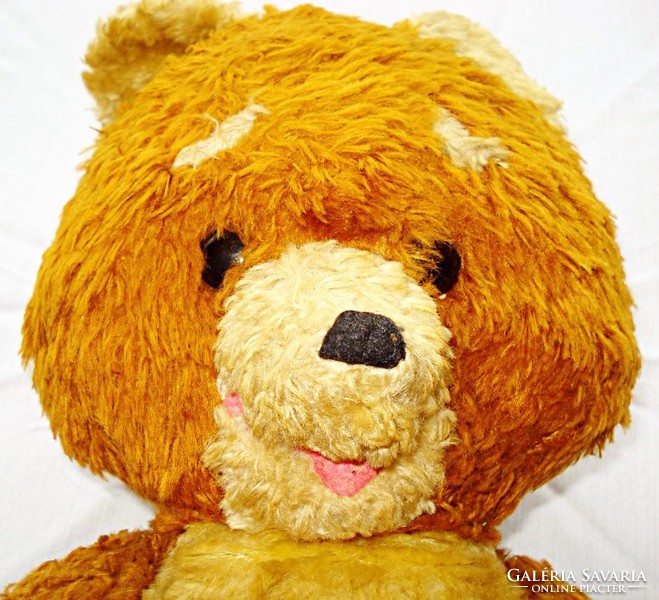 A rumbling teddy bear stuffed with straw