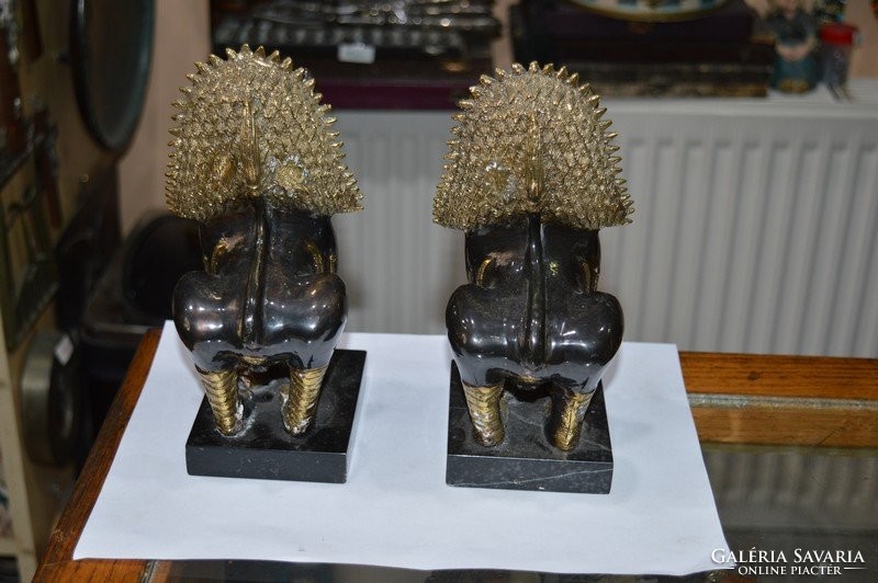 2 pieces of copper Indonesian figurine on a marble base