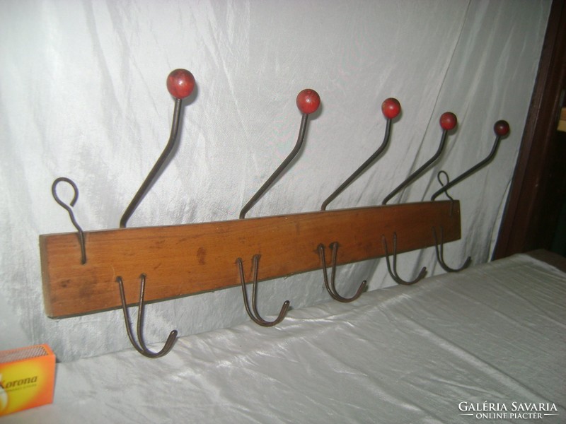 Old wall hanger with wooden buttons