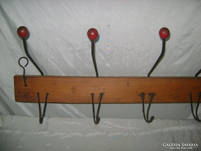 Old wall hanger with wooden buttons