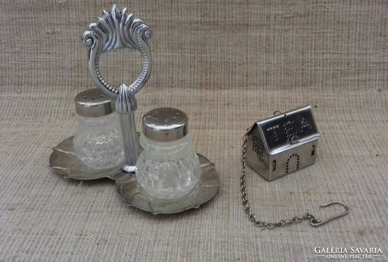In good condition, a house-shaped salt and pepper holder with tea making egg