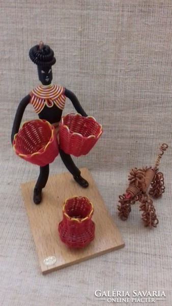 A bent negro female figure with a basket and a dog, handmade from retro marked wire