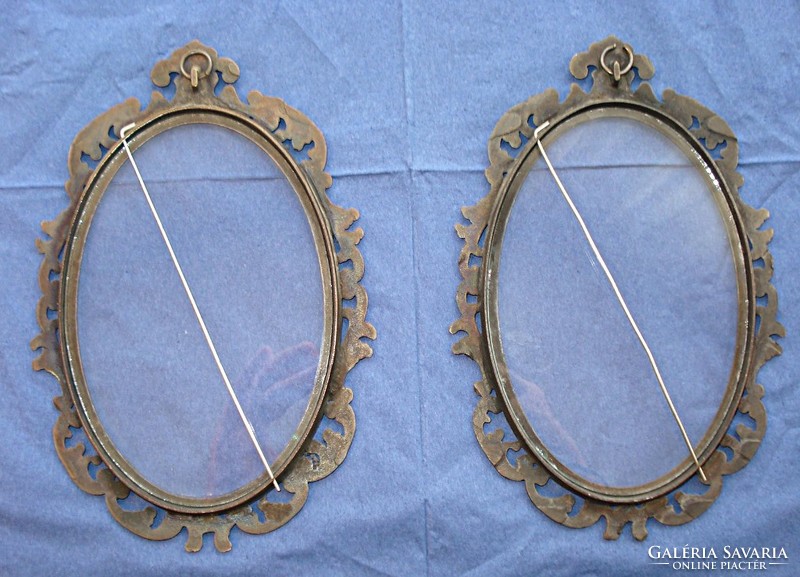 A pair of baroque glazed wall bronze picture frames