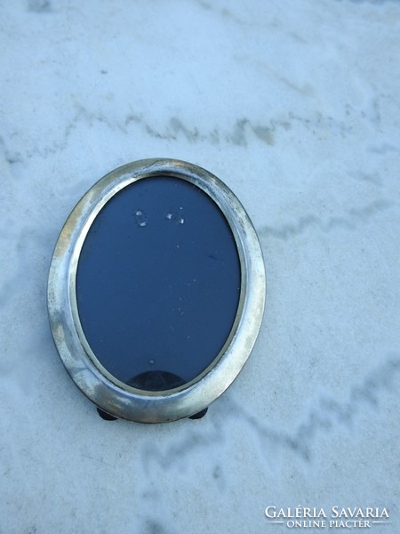 Oval silver colored vintage mirror