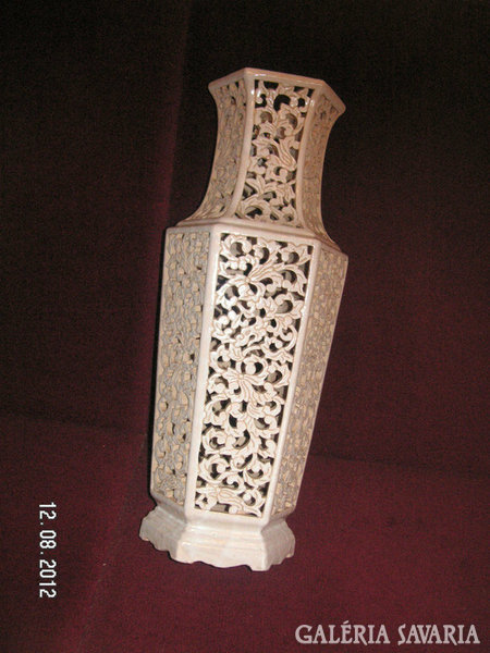 A large openwork vase, without a mark, (perhaps fischer) can be a nice decoration for the apartment