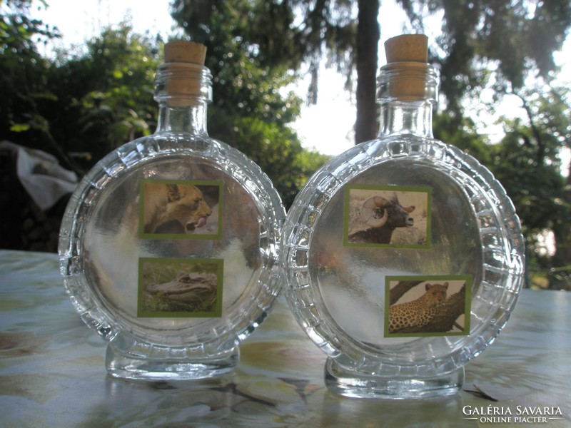 Glass bottle with bottle of brandy with animal motifs